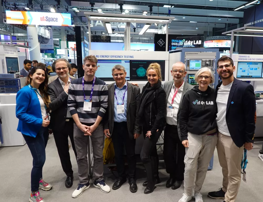 The team at the i14y Lab booth at the Rohde & Schwarz stand