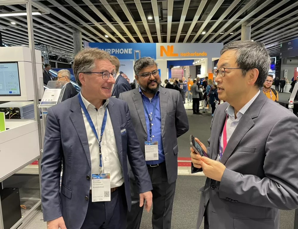 at the i14y booth at Rohde & Schwarz with Alexander Pabst and Alex Choi